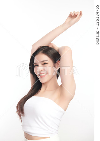 Beautiful Young Asian woman Raises her hands to Showcase clean and hygienic underarms Against a white background, Smooth armpit cleanliness and protection concept Beautiful Young Asian woman Raises her hands to Showcase clean and hygienic underarms Against a white background, Smooth armpit cleanliness and protection concept 126184765