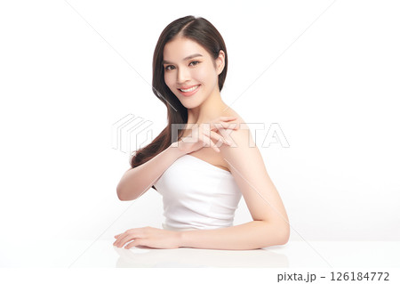 A beautiful young Asian woman with clean, fresh skin against a white background. Skincare, facial treatment, cosmetology, beauty, and spa. An elegant portrait of an Asian woman. A beautiful young Asian woman with clean, fresh skin against a white background. Skincare, facial treatment, cosmetology, beauty, and spa. An elegant portrait of an Asian woman. 126184772
