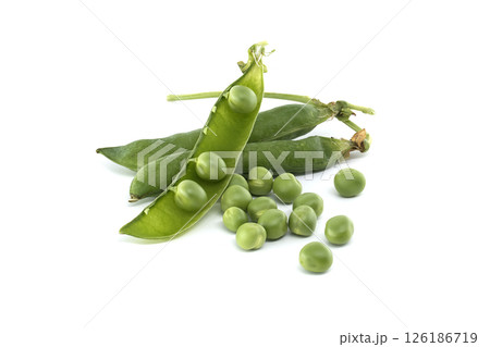 An overhead shot of fresh green peas, some in pods, isolated on a bright white surface. 126186719