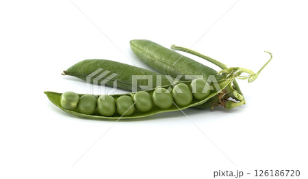 Close-up of fresh green peas spilling from their pods on a clean, white backdrop. Close-up of fresh green peas spilling from their pods on a clean, white backdrop. 126186720