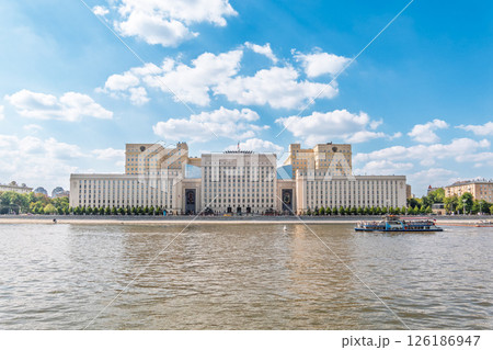 View of the Ministry of Defence of Russian Federation, and Moscow river embankment with cruise ships at sunset. 126186947