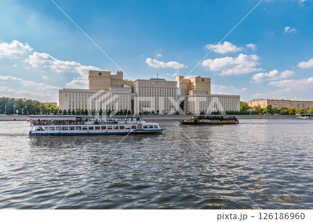 View of the Ministry of Defence of Russian Federation, and Moscow river embankment with cruise ships at sunset. 126186960