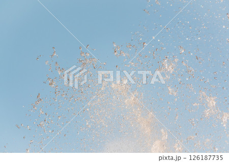 Splashes and jets of water against light background. Splashes and jets of water against light background. 126187735