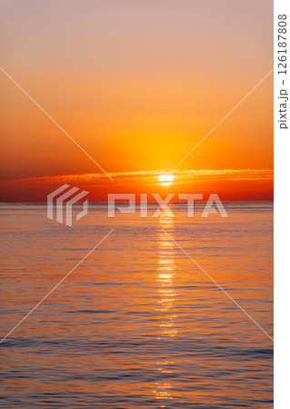 Beautiful red and orange sunrise over the sea. 126187808