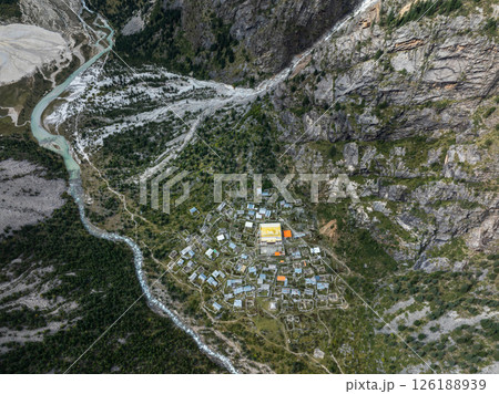 Aerial view of beautiful high altitude forest canyon and snow capped mountain landscape Aerial view of beautiful high altitude forest canyon and snow capped mountain landscape 126188939