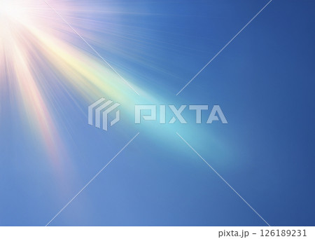 斜め上から虹色の光が差し込む 青背景 斜め上から虹色の光が差し込む 青背景 126189231