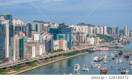 May 11 2025 Modern Urban Cityscape with Elevated Road and Waterfront View May 11 2025 Modern Urban Cityscape with Elevated Road and Waterfront View 126189272