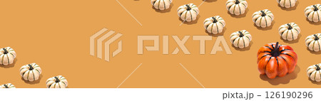 Long Horizontal banner with orange and white pumpkin pattern on orange background. Halloween concept copy space place 126190296