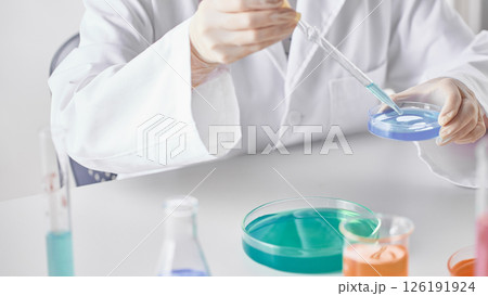 Hands Performing Scientific Experiments in a Modern Laboratory Setting. 126191924