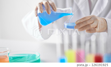 Hands Performing Scientific Experiments in a Modern Laboratory Setting. 126191925