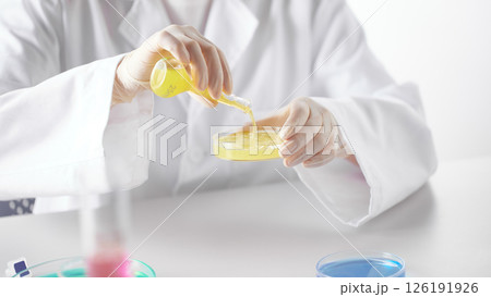 Hands Performing Scientific Experiments in a Modern Laboratory Setting. Hands Performing Scientific Experiments in a Modern Laboratory Setting. 126191926