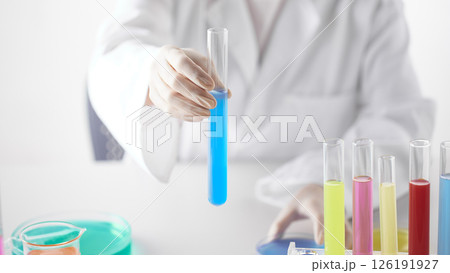 Hands Performing Scientific Experiments in a Modern Laboratory Setting. Hands Performing Scientific Experiments in a Modern Laboratory Setting. 126191927