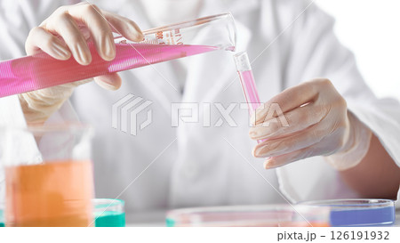 Hands Performing Scientific Experiments in a Modern Laboratory Setting. Hands Performing Scientific Experiments in a Modern Laboratory Setting. 126191932