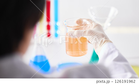 Hands Performing Scientific Experiments in a Modern Laboratory Setting. 126191962