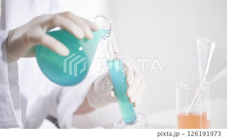 Hands Performing Scientific Experiments in a Modern Laboratory Setting. 126191973