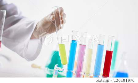 Hands Performing Scientific Experiments in a Modern Laboratory Setting. Hands Performing Scientific Experiments in a Modern Laboratory Setting. 126191976