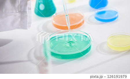 Hands Performing Scientific Experiments in a Modern Laboratory Setting. Hands Performing Scientific Experiments in a Modern Laboratory Setting. 126191979