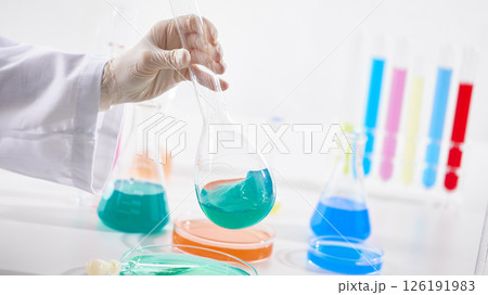 Hands Performing Scientific Experiments in a Modern Laboratory Setting. Hands Performing Scientific Experiments in a Modern Laboratory Setting. 126191983