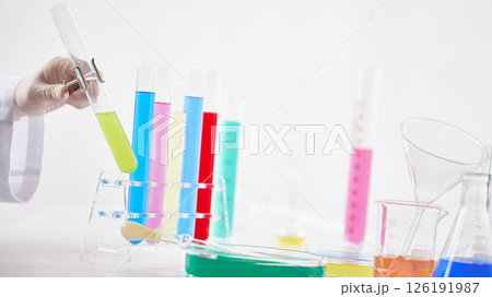 Hands Performing Scientific Experiments in a Modern Laboratory Setting. 126191987