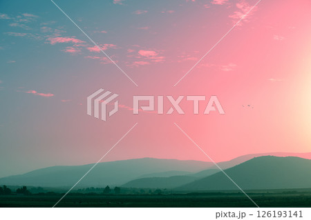 Silhouette of mountains against the sunset sky Hula Valley in northern Israel in the evening 126193141