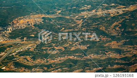 View From Airplane Window On Suburb Of Chengdu, China. Mountainous Landscape Of China. Porthole View Or Called Bull's-eye Window. Discover China. Chengdu Is Capital City Of Chinese Province Of Sichuan View From Airplane Window On Suburb Of Chengdu, China. Mountainous Landscape Of China. Porthole View Or Called Bull's-eye Window. Discover China. Chengdu Is Capital City Of Chinese Province Of Sichuan 126193168