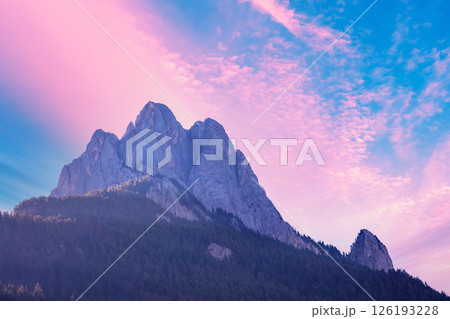 The Dolomites Alps against the sunset sky. View of Mountain ridge during sunrise in the Dolomites, South Tyrol, Italy The Dolomites Alps against the sunset sky. View of Mountain ridge during sunrise in the Dolomites, South Tyrol, Italy 126193228