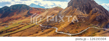 Panoramic view of Mountain ridge from above. Mountain Marmolada. Regional Road 48 of the Dolomites. Pordoi pass in The Dolomites, Belluno, Italy. Horizontal banner 126193304