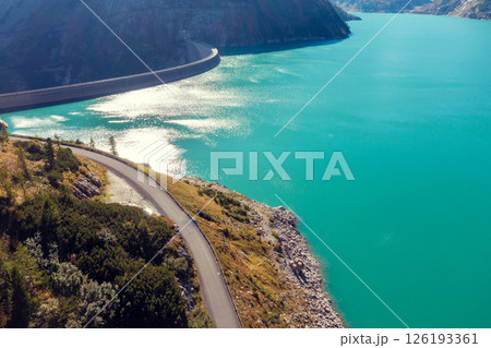 View from above of the mountain lake Kolnbreinspeicher in autumn and the Kolnbrein dam. Gamskarnock, Austria Europe 126193361