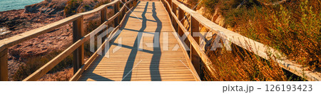 A wooden platform on the beach. Horizontal banner 126193423