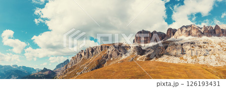 Panoramic view of the mountain landscape in autumn. Piz Boe, Sella Towers. Pordoi Pass in the Dolomites, South Tyrol, Italy.  Horizontal banner 126193431