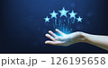 Hand of a woman holding five best star review scores or satisfaction. 126195658