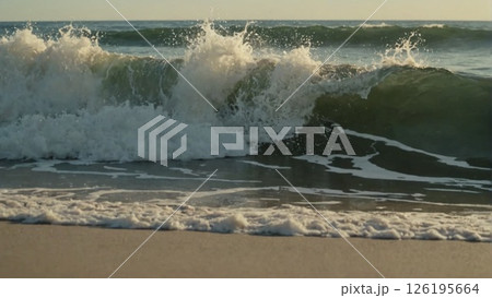 waves crashing on the beach, close-up. Close up view of colored sea waves with splashes and white breakers. Big strong wave splash and spray closeup.  126195664