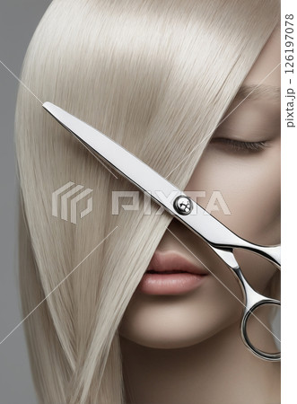 blond woman with straight hair and scissors 126197078