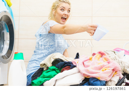 Woman showing washing powder Woman showing washing powder 126197861