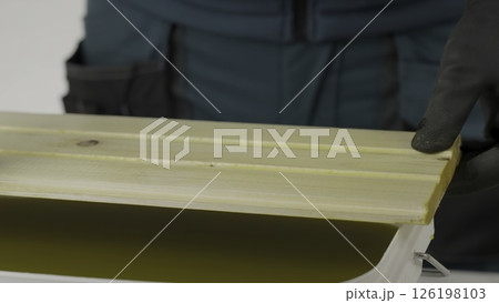 A tutorial shows treating wood with a yellow liquid, ensuring even coverage. Creative 126198103