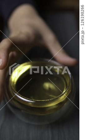 Experience the Delicate and Refreshing Green Tea served elegantly in a Traditional Glass Bowl. Media Experience the Delicate and Refreshing Green Tea served elegantly in a Traditional Glass Bowl. Media 126198266