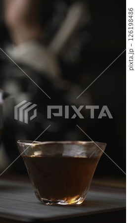 An Aromatic Cup of Tea, with Steam Rising, in Soft and Inviting Lighting Atmosphere. Media An Aromatic Cup of Tea, with Steam Rising, in Soft and Inviting Lighting Atmosphere. Media 126198486