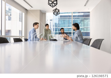 People engaged in professional business meeting in modern boardroom People engaged in professional business meeting in modern boardroom 126198571