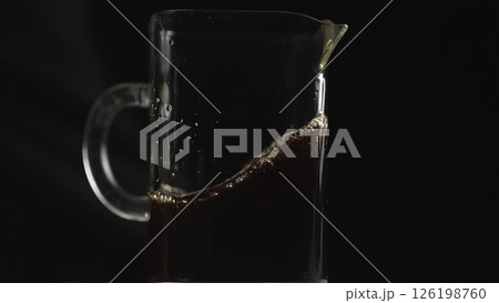Brewing Coffee in a Glass Pitcher for an Invigorating Morning Beverage Experience. Media 126198760
