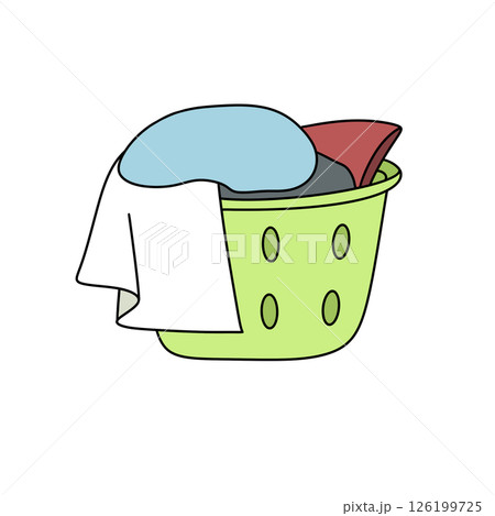 A green laundry basket with a white towel and a blue pillow 126199725