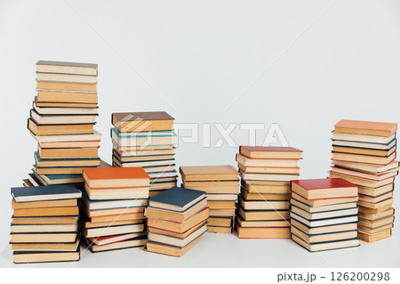 Stacks of educational books for learning on a white background Stacks of educational books for learning on a white background 126200298