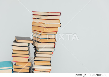 Stacks of educational books for learning on a white background Stacks of educational books for learning on a white background 126200300