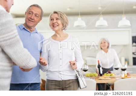 Couple of elderly man and woman greeting friends Couple of elderly man and woman greeting friends 126201191
