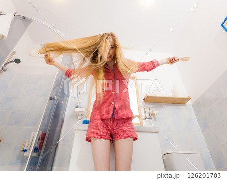 Woman with long windblown blonde hair Woman with long windblown blonde hair 126201703