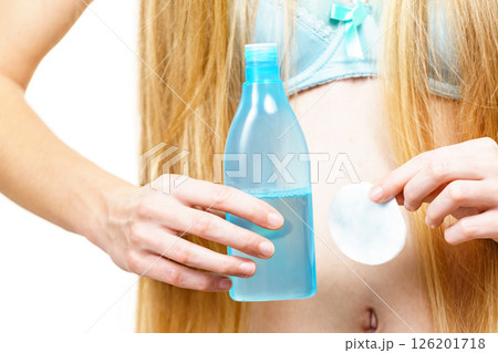 Woman using cleanser cosmetic Woman using cleanser cosmetic 126201718