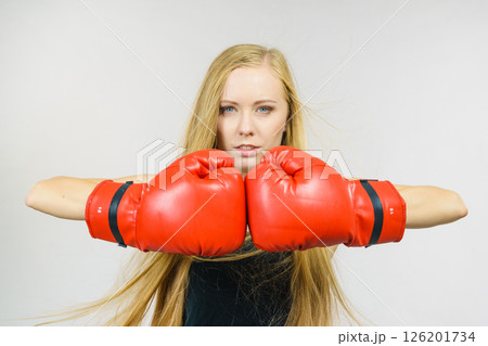 Woman in gloves playing sports boxing 126201734