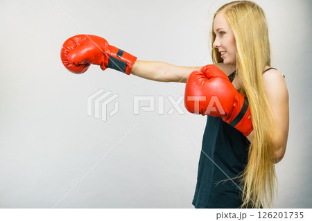 Woman in red gloves boxing Woman in red gloves boxing 126201735