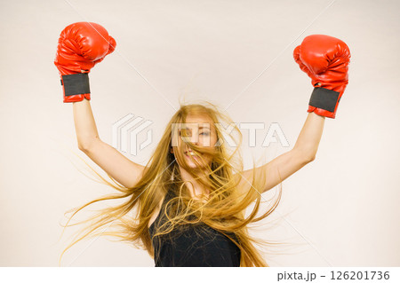 Woman in red gloves with arms up Woman in red gloves with arms up 126201736