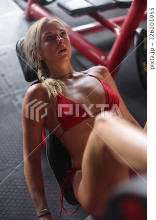 Engaging in an Intense Workout Session at the Gym A Dedicated Fitness Enthusiast Training Hard Engaging in an Intense Workout Session at the Gym A Dedicated Fitness Enthusiast Training Hard 126201955