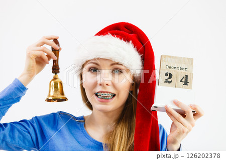 Woman and christmas calendar with bell Woman and christmas calendar with bell 126202378